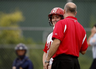 softball coach speaking with player