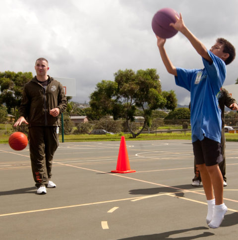 youth playing basketball